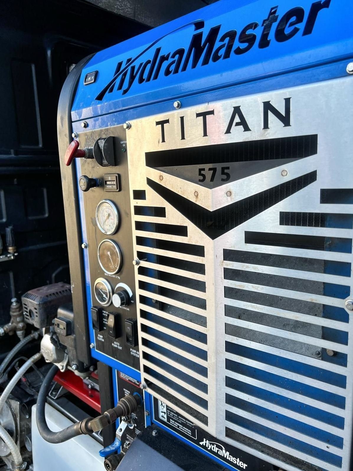 HydraMaster Titan 575 truck-mounted cleaning unit inside a DynoClean van